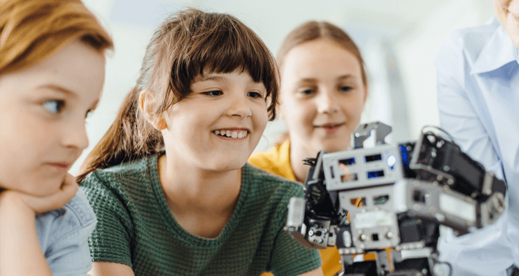 young students looking at a science project
